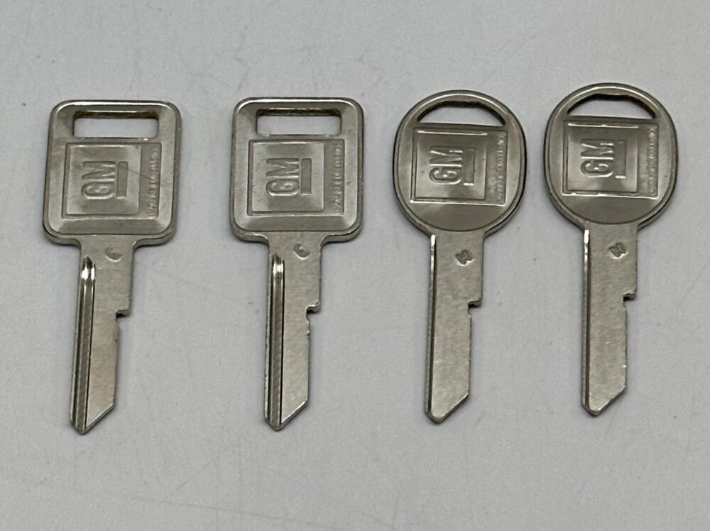 4 NEW GM LOGO OEM "E" IGNITION "H" DOOR TRUNK KEY BLANKS 320404 - 320405